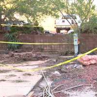 Floodwaters push shipping container through wall at Hurricane RV park