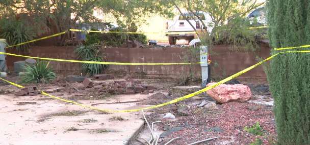 Floodwaters push shipping container through wall at Hurricane RV park