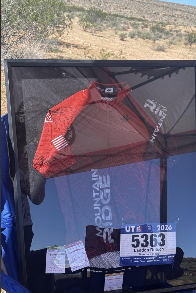 Utah Mountain Bike State Championship organizers organizers have set up a cheering zone on the trail with Landon's jersey displayed.