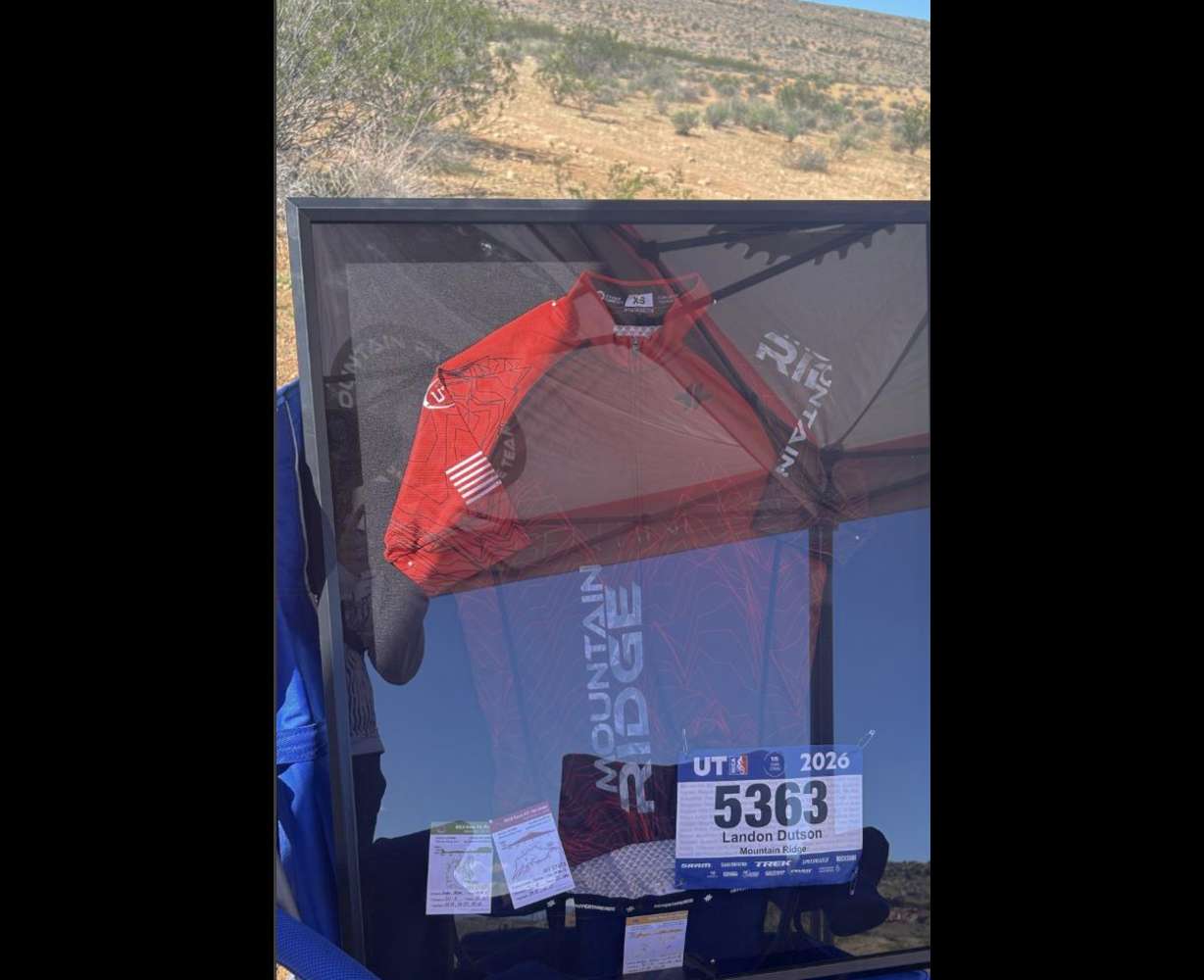 Utah Mountain Bike State Championship organizers organizers have set up a cheering zone on the trail with Landon's jersey displayed.