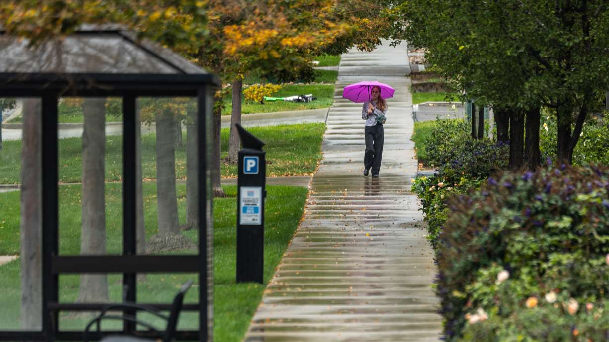 A woman on a rainy day in Salt Lake City on Sept. 28. Parts of Utah are out of moderate drought for the first time in seven months, the U.S. Drought Monitor reported on Thursday.