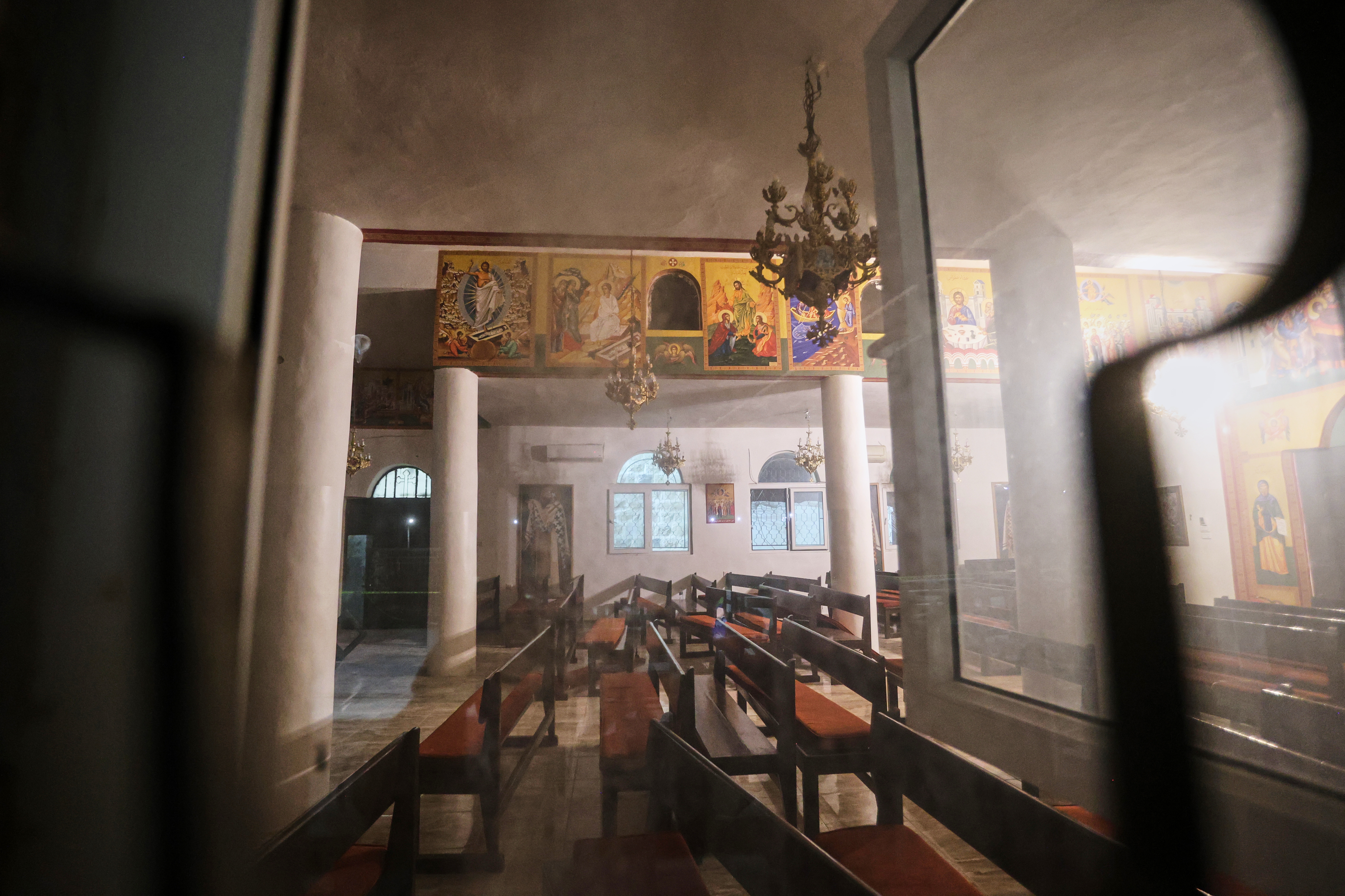 The interior of a Greek Orthodox church is seen hours after gunmen opened fire during a funeral in Hamoud village, in Jordan's Karak governorate, Friday.
