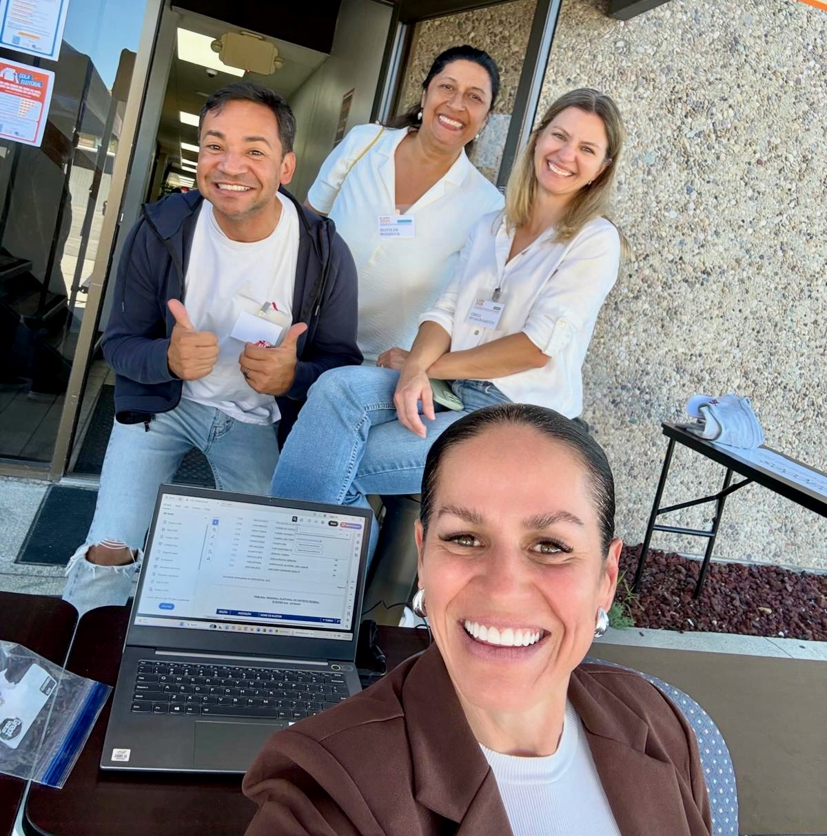 Some 2,800 Brazilians in Utah are eligible to cast ballots in the state in Brazil's presidential contest on Sunday. Carolina Herrin, in the foreground, and others are pictured during the first round of presidential voting on Oct. 4 at the Millcreek polling site.