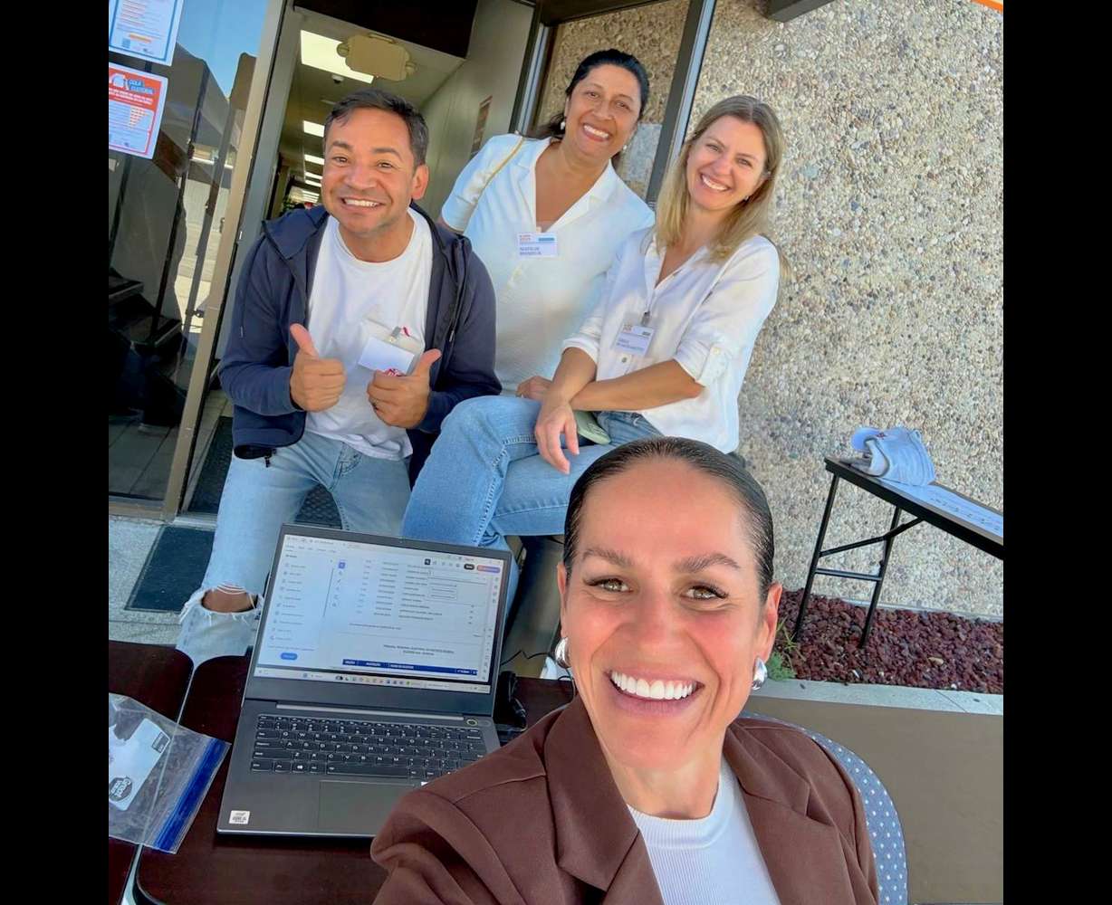 Some 2,800 Brazilians in Utah are eligible to cast ballots in the state in Brazil's presidential contest on Sunday. Carolina Herrin, in the foreground, and others are pictured during the first round of presidential voting on Oct. 4 at the Millcreek polling site.