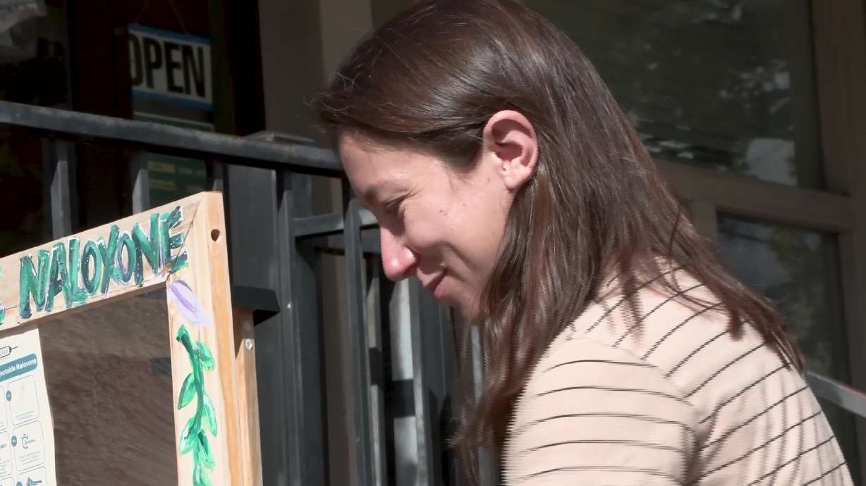 MacKenzie Bray, executive director of the Salt Lake Harm Reduction Project, replenishes a "Naloxey Boxey," Friday. The nonprofit works to prevent overdoses, reduce stigma surrounding addiction and connect people with treatment and recovery resources.