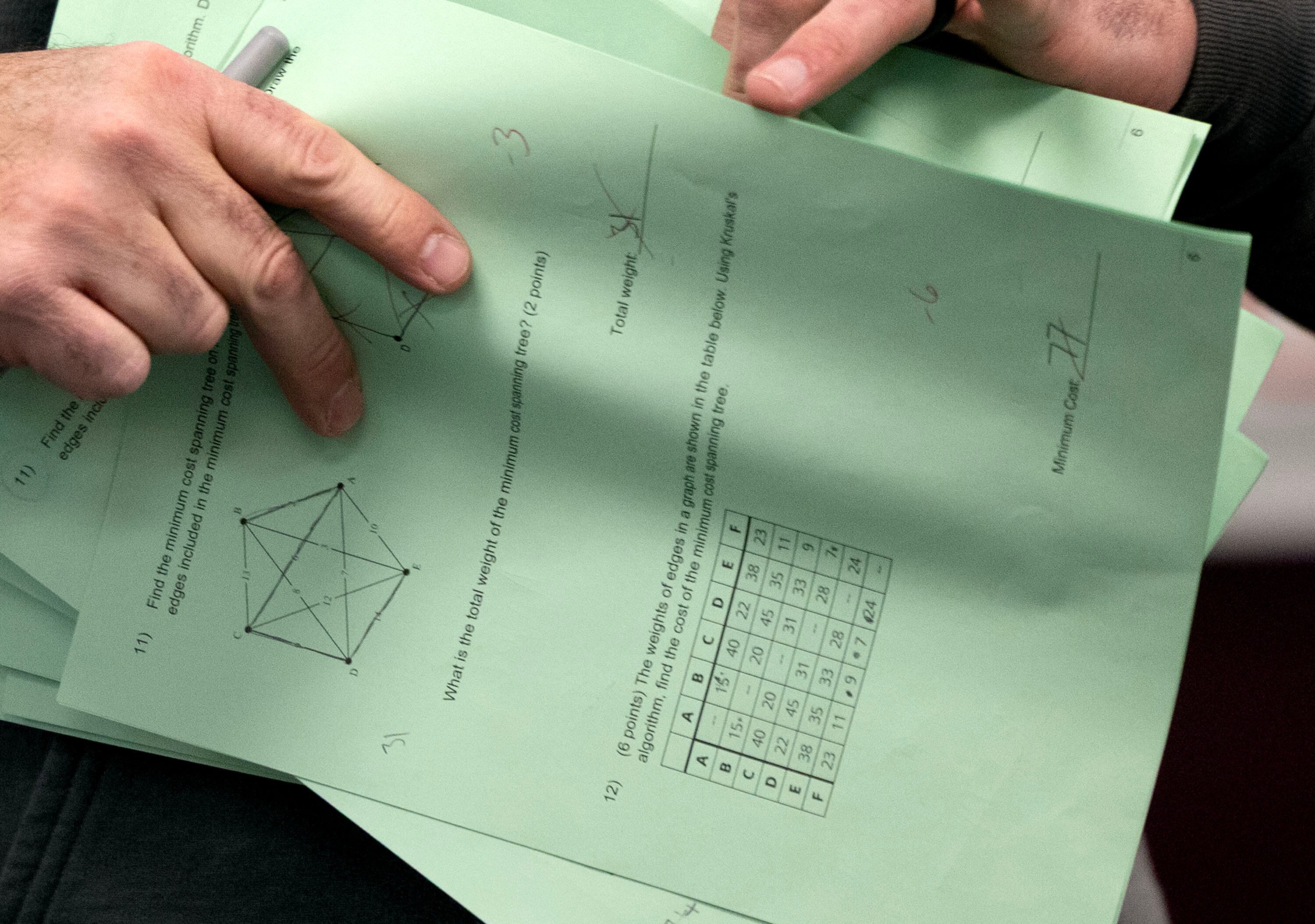 A teacher returns an exam at Jordan High School in Sandy on Jan. 15. The number of students in K-12 schools in Utah is declining.