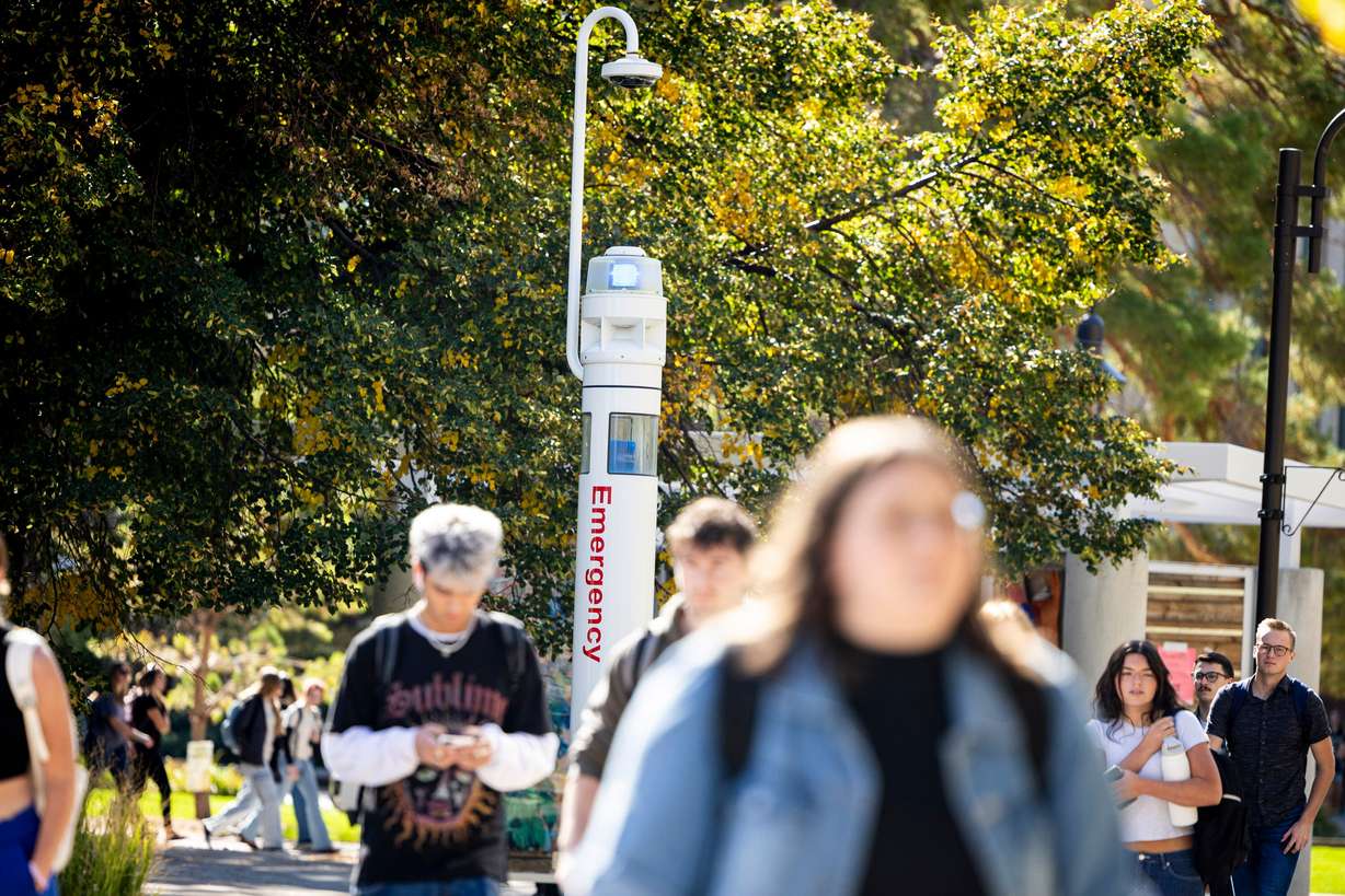 Students pass by an emergency terminal on the campus of Utah State University in Logan on Oct. 1, 2025. Higher education enrollment saw a slight increase but may decline soon, based on declining enrollment in Utah K-12 schools.