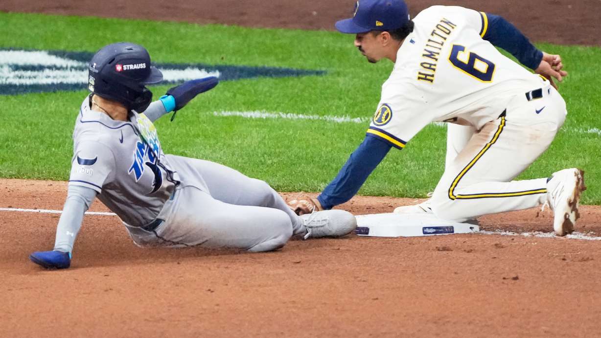 Tampa Bay Rays' Victor Mesa Jr. is tagged out stealing by Milwaukee Brewers third baseman David Hamilton during the fifth inning of Game 1 of baseball's World Series, Friday, Oct. 23, 2026, in Milwaukee, between the Milwaukee Brewers and the Tampa Bay Rays.