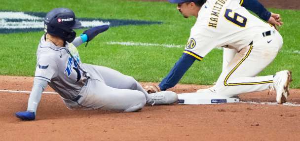 Balls glancing off gloves, runners thrown out trying to steal sink Rays in World Series opener