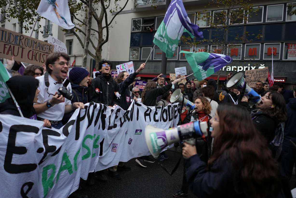 Students chant slogans during a demonstration against rising living costs in Paris, Saturday. Clashes erupted during the protests, with police making nearly 1,000 arrests.