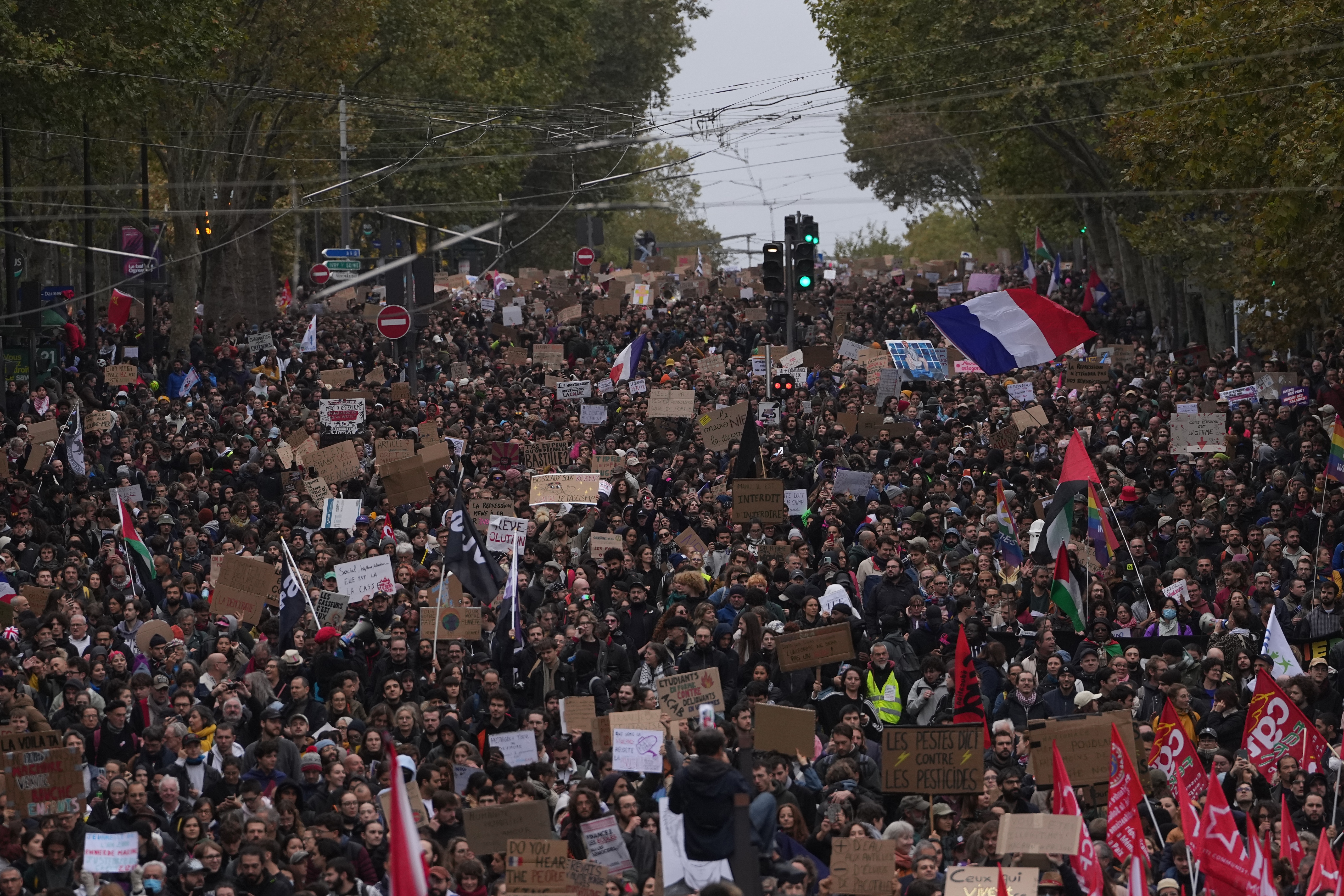 More than 400,000 protest across France, challenging Macron as Paris clashes erupt