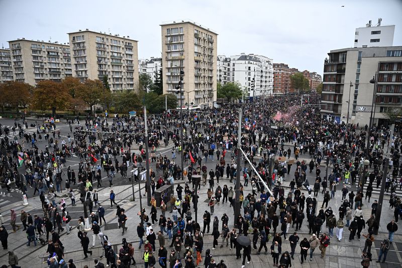 Protesters arrive at the Porte de Vincennes during an authorised demonstration organised by labour unions in Paris as part of nationwide protests called by the "Yellow Vests" movement joined by French high school and university students against the cost of living and rising fuel prices, in France, Saturday.