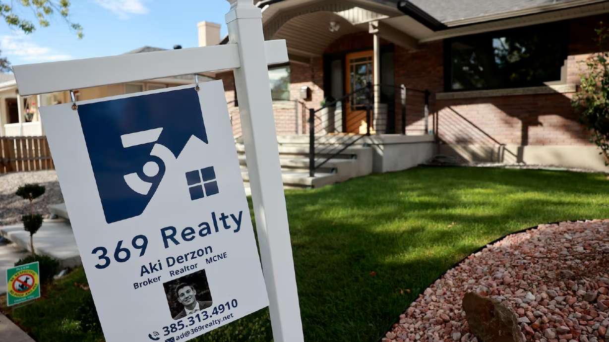 A for-sale sign is pictured outside a house in Salt Lake City on Wednesday.