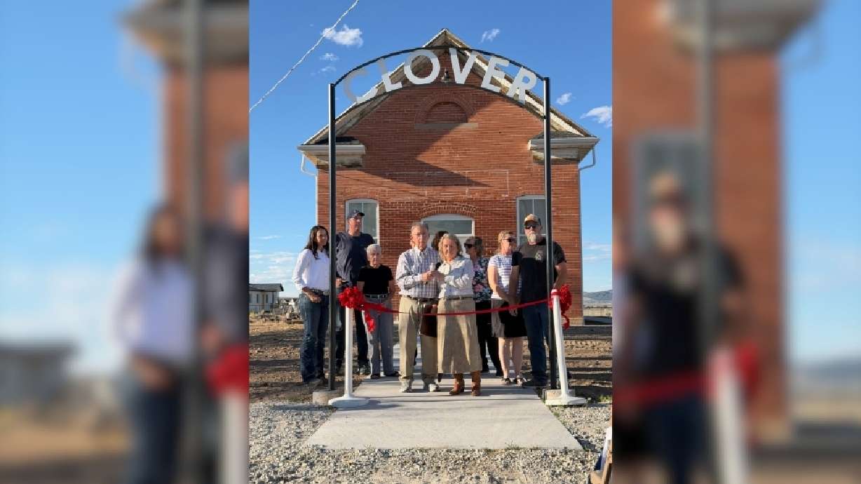 Carol Cluff cuts the ribbon alongside her husband, John, on Sept. 11, outside the Clover Ward meetinghouse in Rush Valley, Tooele County, in Utah.