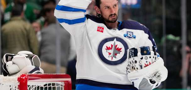 Hellebuyck happy to be with the Devils after a long wait for a trade from the Jets