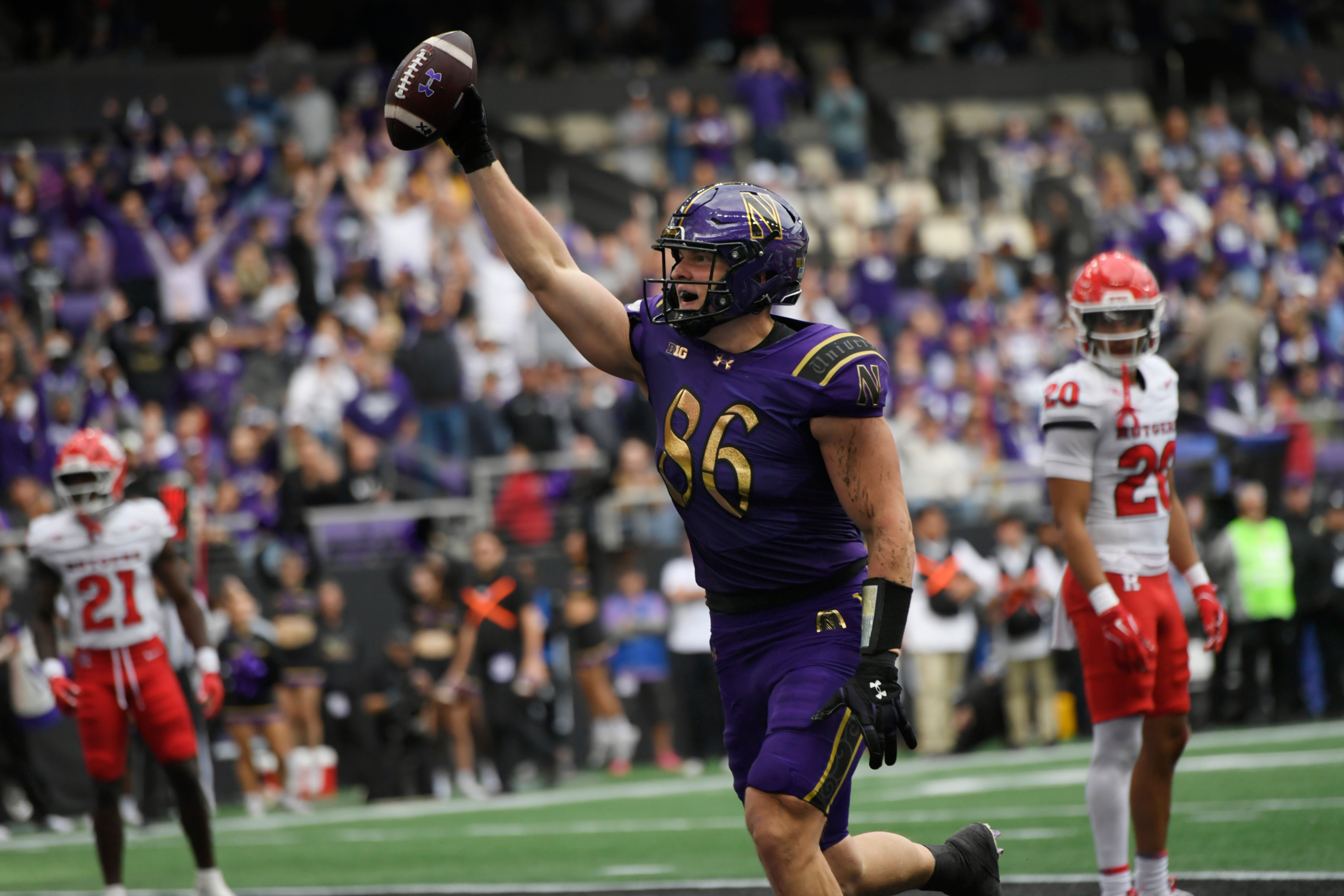 Aidan Chiles throws for 3 TD, runs in 2 more, and No. 24 Northwestern beats Rutgers 42-14