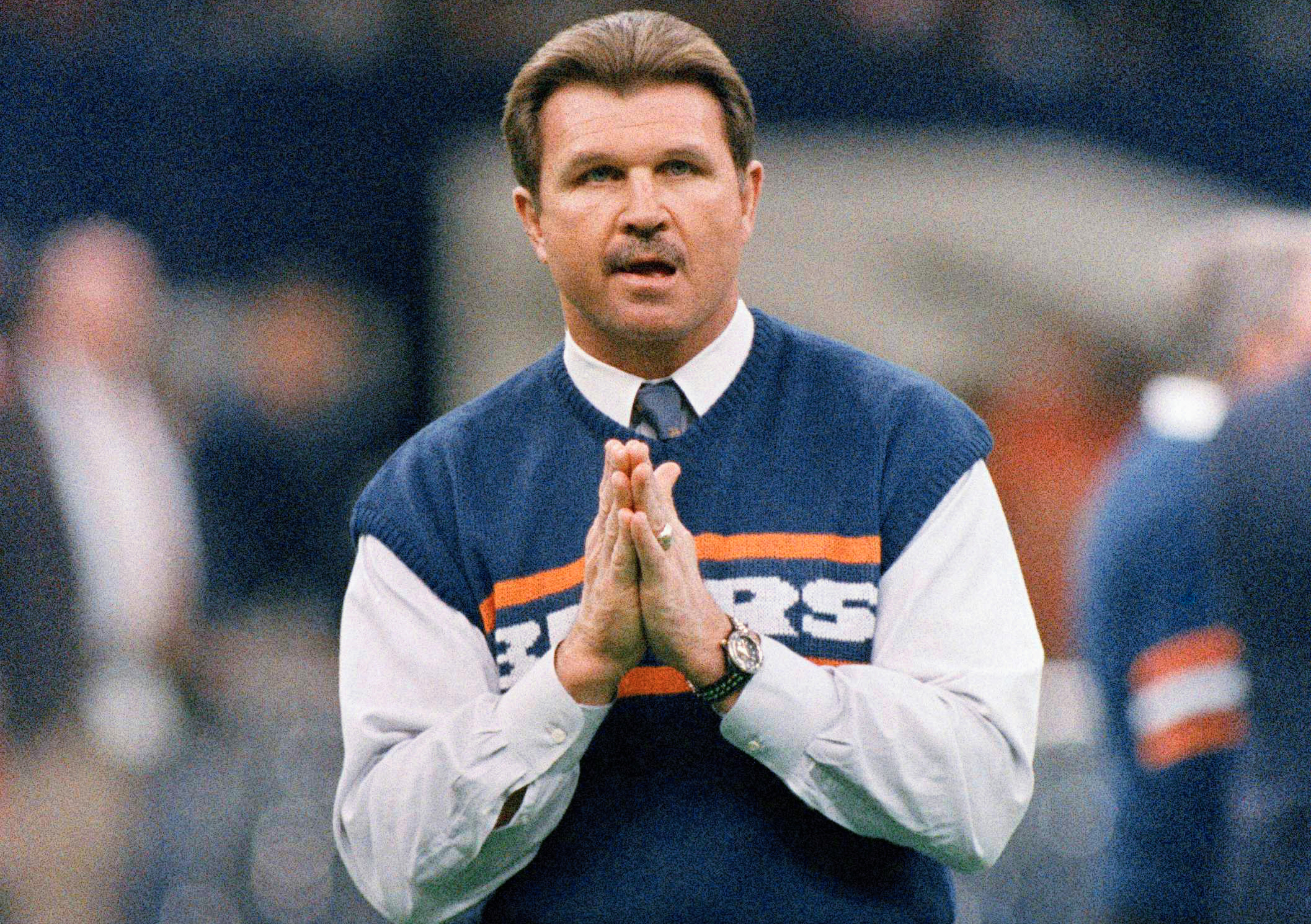 FILE - Chicago Bears head coach Mike Ditka strikes a prayerful pose as he watches the team workout, Jan. 26, 1986 in New Orleans before the start of NFL football's Super Bowl XX.