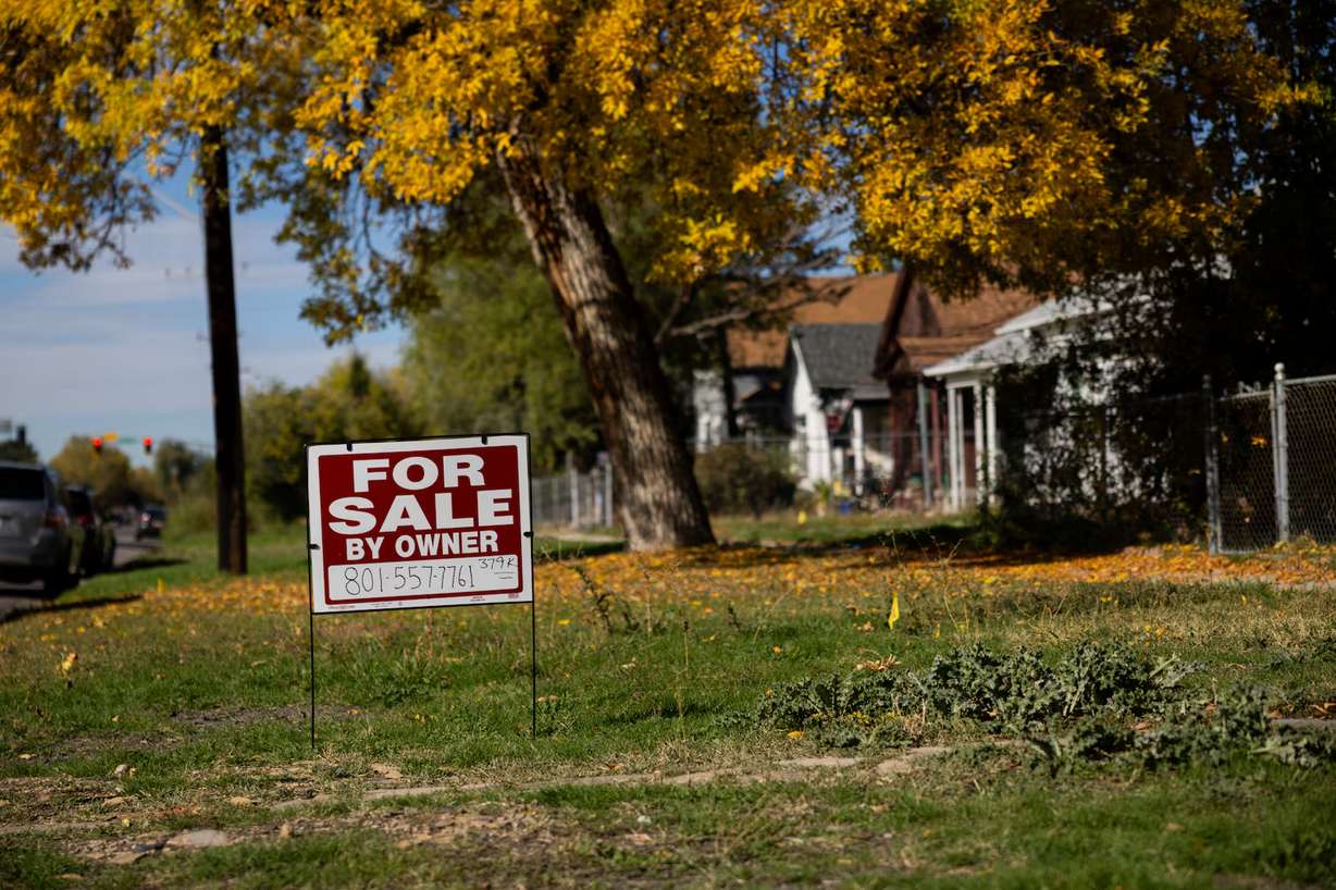 A sign for a house for sale in the Fairpark neighborhood in Salt Lake City on Wednesday. Pending U.S. home sales are at a new low.