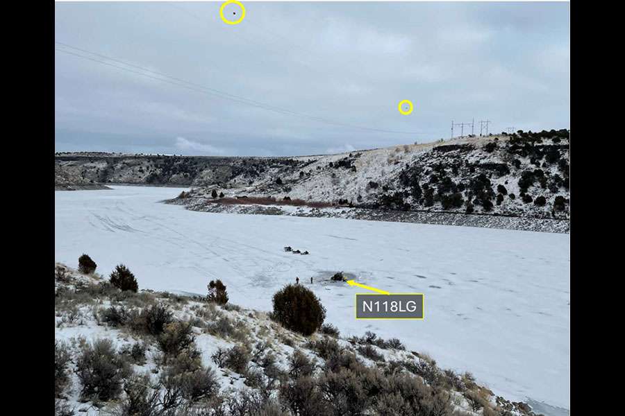 A view from the site of a February 2025 helicopter crash at Ririe Reservoir in Idaho, showing the marked power lines above. The report on the crash said pilot error was the probable cause.