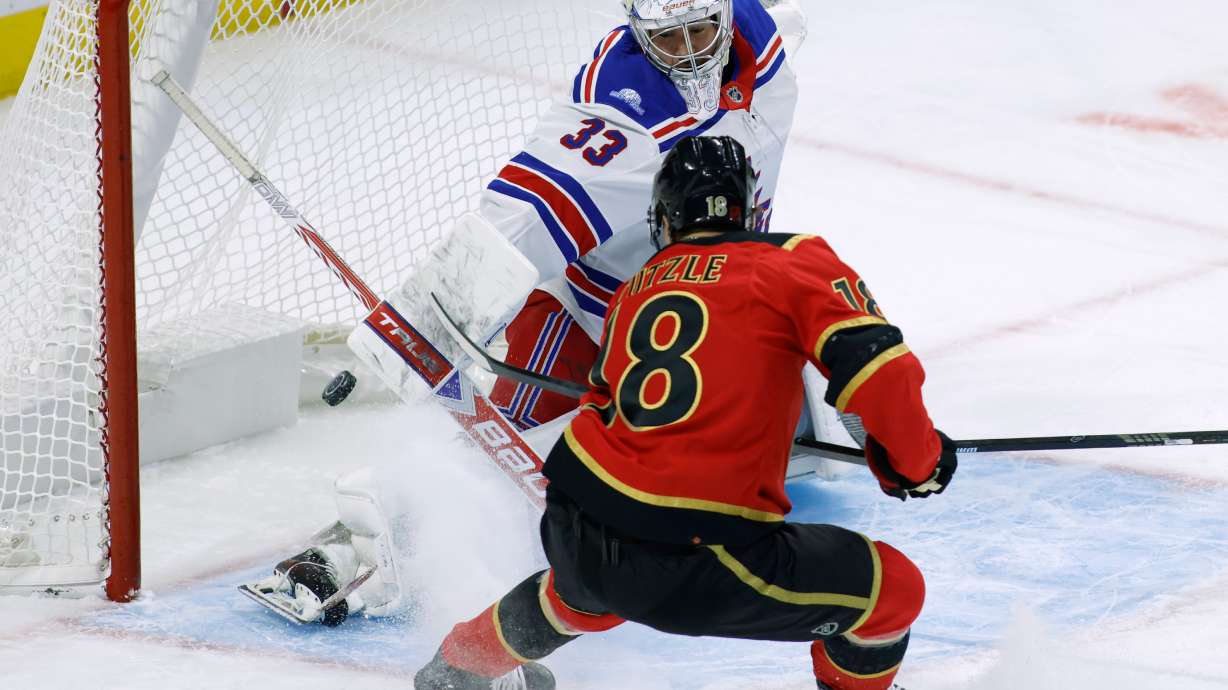 Ottawa Senators' Tim Stutzle (18) scores against New York Rangers goaltender Dylan Garand (33) during the first period of an NHL hockey game in Ottawa, Ontario, Saturday, Oct. 24, 2026.