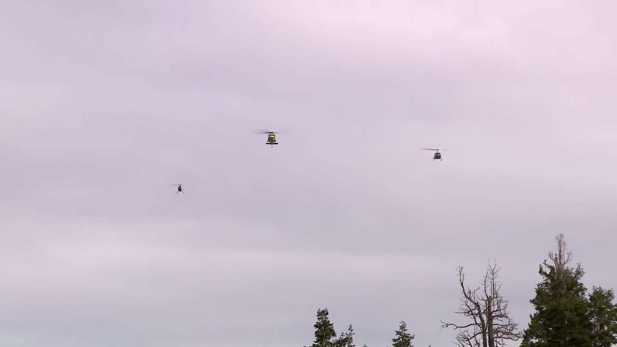 Helicopters fly over the celebration of life for Ryan Cutter, in Park City, Saturday. Cutter died in late September while fighting the Dome Fire in California.