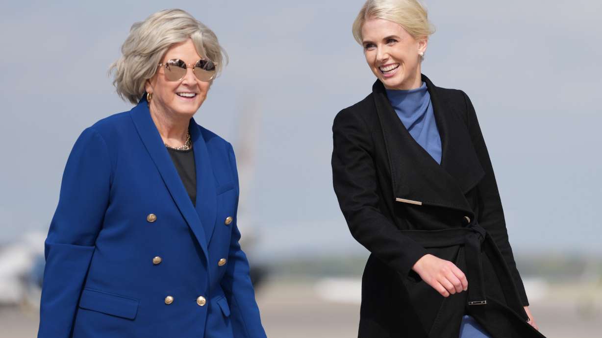 White House chief of staff Susie Wiles and White House aide Natalie Harp walk to board Air Force One, Friday, Oct. 16, 2026, at Joint Base Andrews, Md.