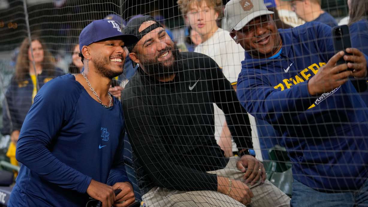 Tampa Bay Rays pitcher Freddy Peralta takes a photo with fans prior to Game 2 of baseball's World Series, Saturday, Oct. 24, 2026, in Milwaukee, between the Milwaukee Brewers and the Tampa Bay Rays.