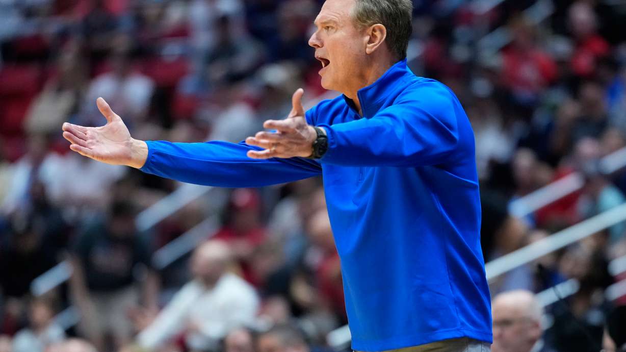 FILE - Kansas head coach Bill Self motions towards the court during the first half of a game between Kansas and St. John's in the second round of the NCAA college basketball tournament Sunday, March 22, 2026, in San Diego.