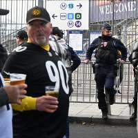 Good mood among fans attending the first NFL game in Paris, a day after protests and clashes