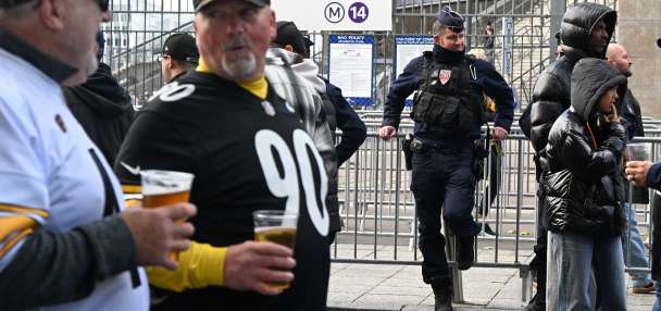 Good mood among fans attending the first NFL game in Paris, a day after protests and clashes