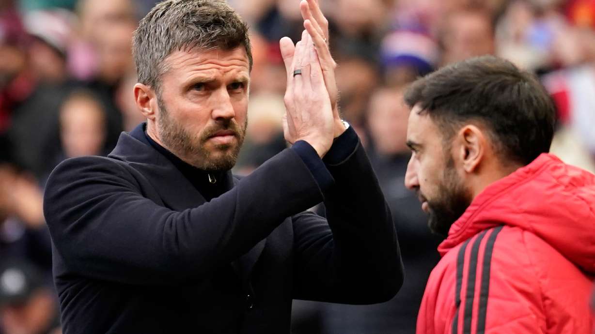 Manchester United's head coach Michael Carrick applauds to supporters ahead of the start of the English Premier League soccer match between Manchester United and Bournemouth in Manchester, England, Sunday, Oct. 25, 2026.