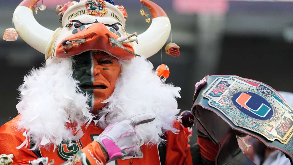 A Miami fan stands in the stands during the second half of an NCAA college football game between Miami and Pittsburgh, Saturday, Oct. 24, 2026, in Miami Gardens, Fla.