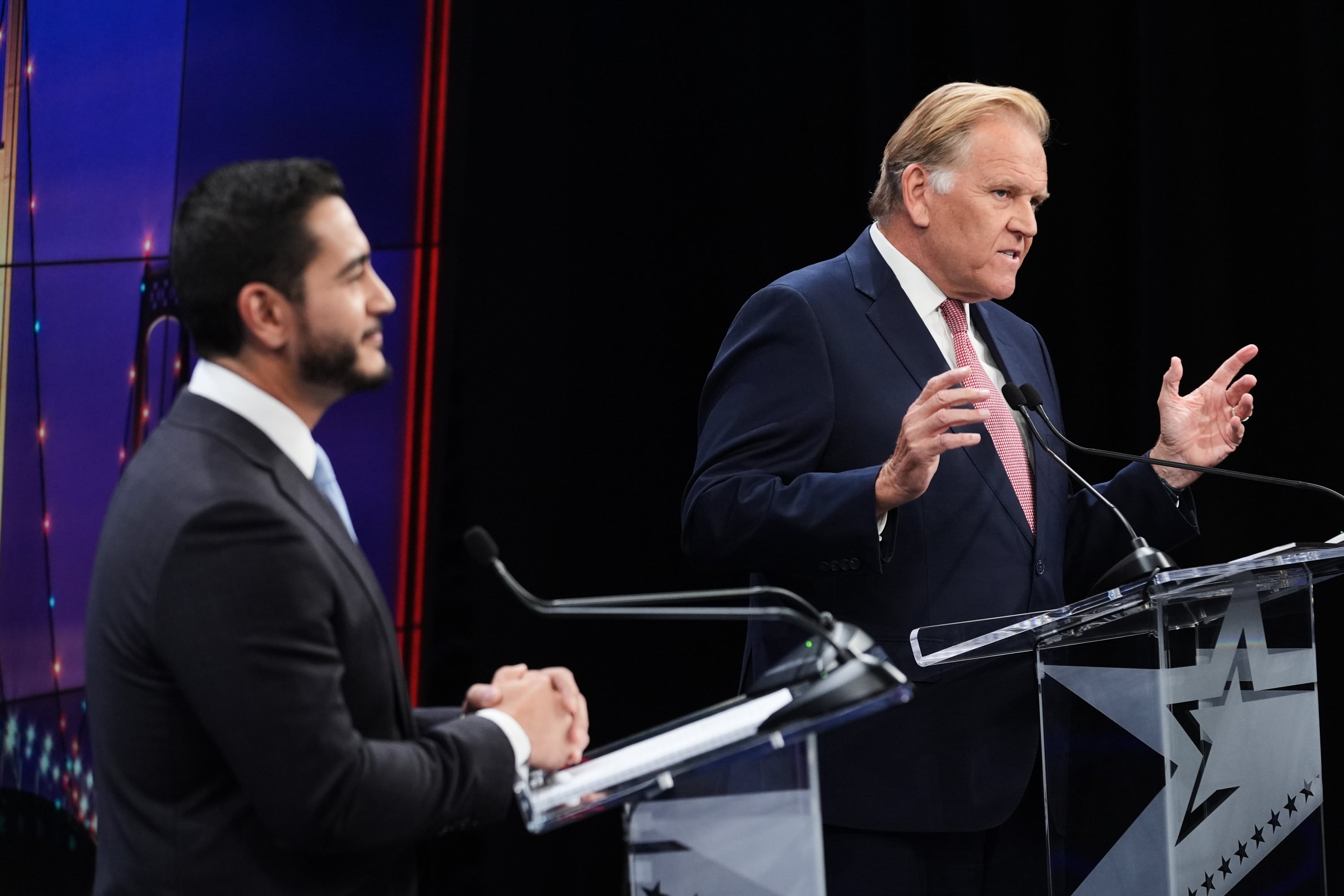 Republican nominee for U.S. Senate Mike Rogers, right, speaks during a televised debate with Democratic nominee for U.S. Senate Abdul El-Sayed, at WOOD-TV, on Oct. 8 in Grand Rapids, Mich.