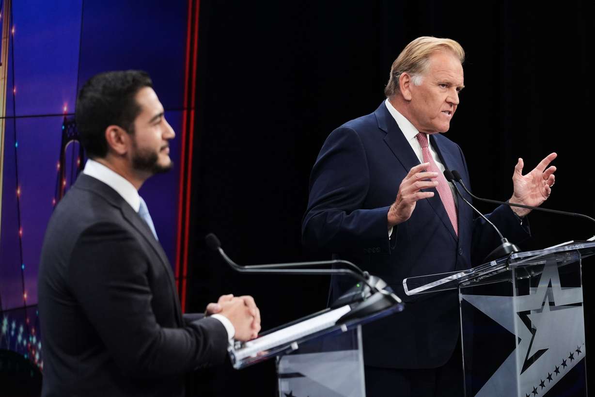 Republican nominee for U.S. Senate Mike Rogers, right, speaks during a televised debate with Democratic nominee for U.S. Senate Abdul El-Sayed, at WOOD-TV, on Oct. 8 in Grand Rapids, Mich.