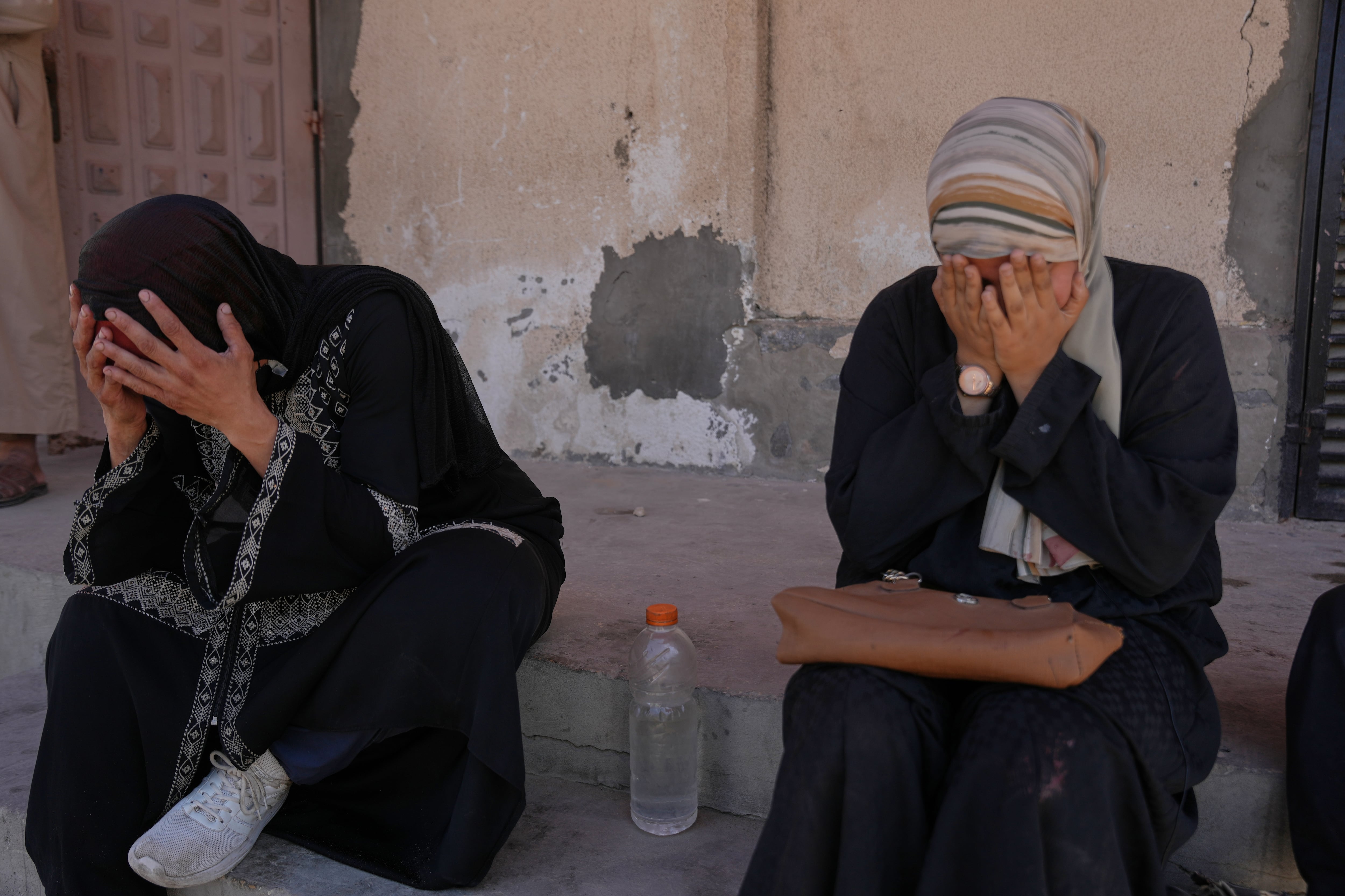 The mother, left, and sister of 14-year-old Mohammed Abu Hammad, who was killed in an Israeli strike, mourn during his funeral at Al-Aqsa Hospital in Deir al-Balah, in the central Gaza Strip, Oct. 17.