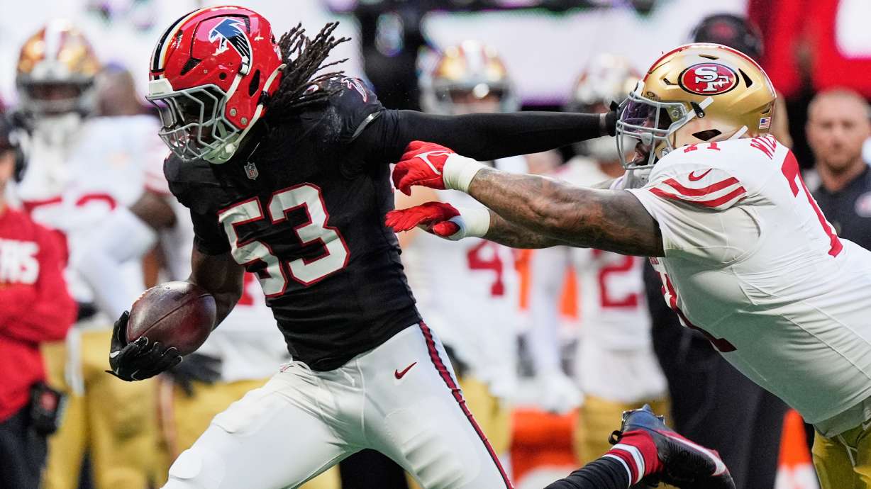 Atlanta Falcons linebacker Kendal Daniels (53) returns an interception as San Francisco 49ers offensive tackle Trent Williams, right, makes the stop during the second half of an NFL football game in Atlanta, Sunday, Oct. 25, 2026.