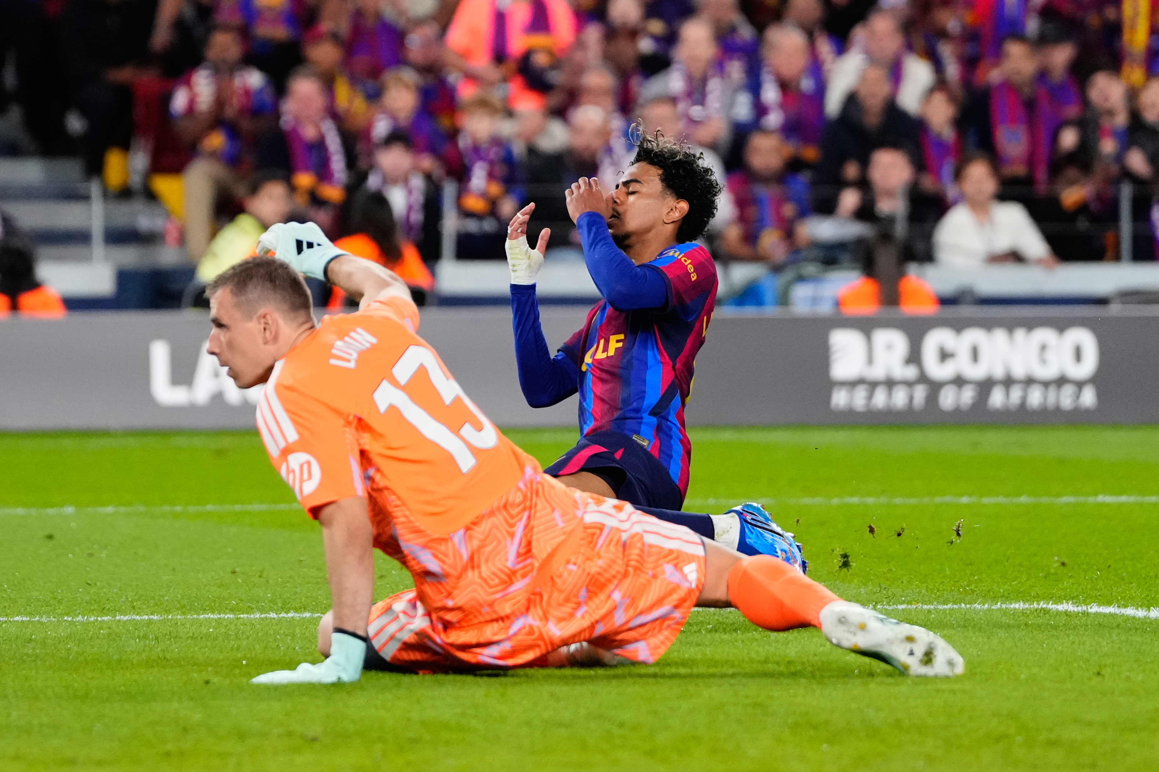 Barcelona's Lamine Yamal, right, reacts after a missed scoring opportunity during a Spanish La Liga soccer match between FC Barcelona and Real Madrid in Barcelona, Spain, Sunday, Oct. 25, 2026. 