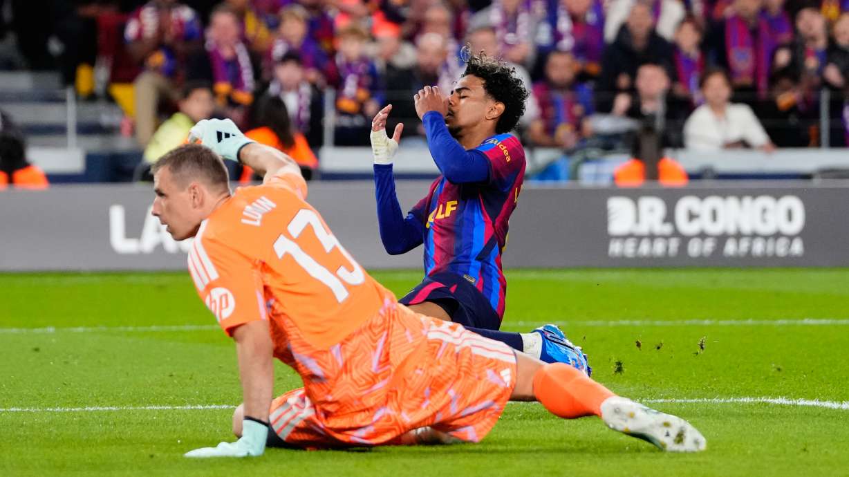 Barcelona's Lamine Yamal, right, reacts after a missed scoring opportunity during a Spanish La Liga soccer match between FC Barcelona and Real Madrid in Barcelona, Spain, Sunday, Oct. 25, 2026.