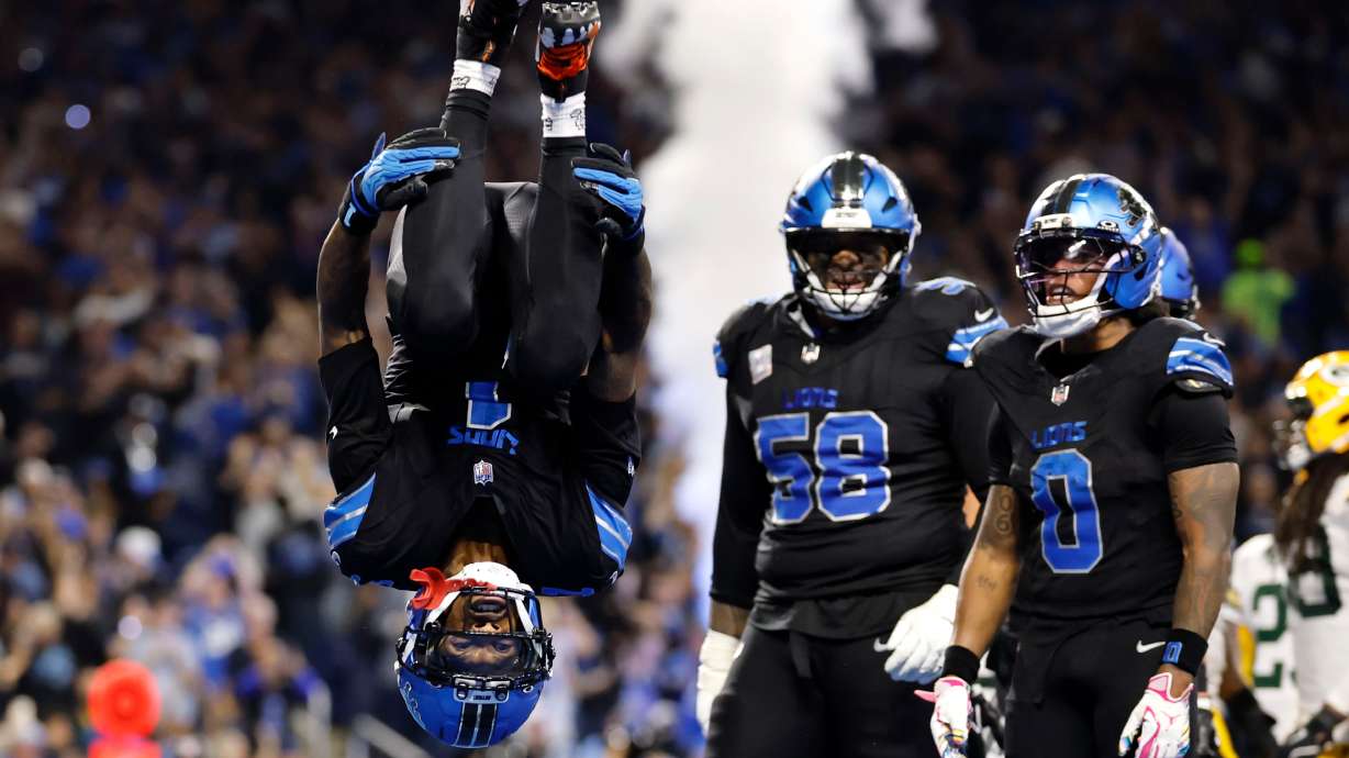 Detroit Lions wide receiver Jameson Williams (1) does a flip after catching a touchdown pass during the second half of an NFL football game against the Green Bay Packers, Sunday, Oct. 25, 2026, in Detroit.