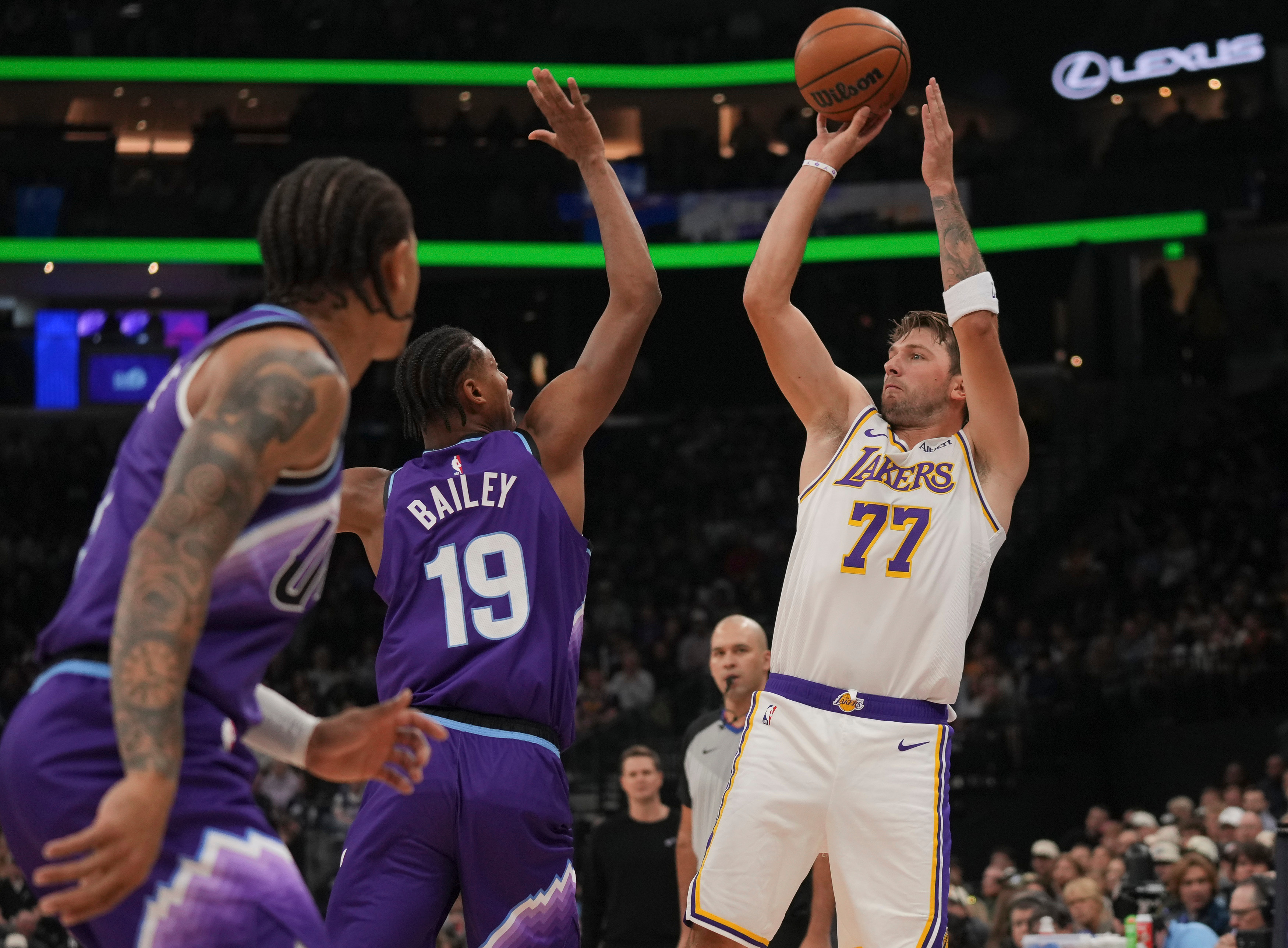 Los Angeles Lakers forward/guard Luka Dončić (77) looks to shoots as Utah Jazz forward Ace Bailey (19) defends during the first half of an NBA basketball game Sunday, Oct. 25, 2026, in Salt Lake City. 