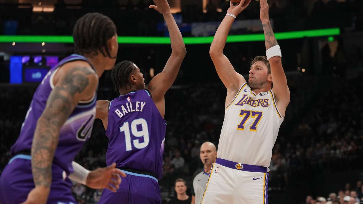 Los Angeles Lakers forward/guard Luka Dončić (77) looks to shoots as Utah Jazz forward Ace Bailey (19) defends during the first half of an NBA basketball game Sunday, Oct. 25, 2026, in Salt Lake City.