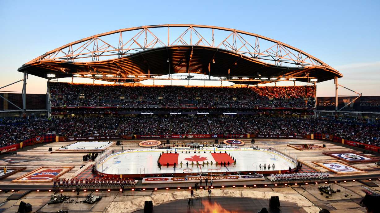 A Canadian flag is unfurled at Princess Auto Stadium before the NHL Heritage Classic hockey game between the Winnipeg Jets and the Montreal Canadiens in Winnipeg, Manitoba, Sunday, Oct. 25, 2026.