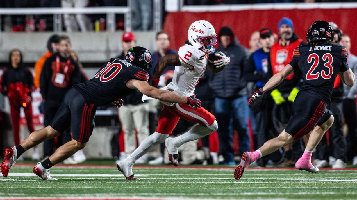 Utah Utes linebacker Trey Reynolds (10) dives to tackle Houston Cougars wide receiver Koby Young (2) during a game at Rice-Eccles Stadium in Salt Lake City on Saturday, Oct. 24, 2026.