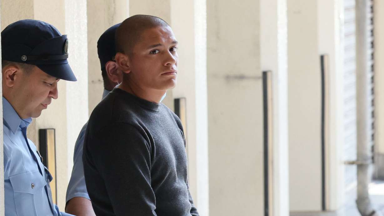 Devin Jacob Ballard leaves the Naha Police Station to be referred to the district prosecutor's office in Naha City, Okinawa Prefecture, Japan, on Oct. 5. Japanese prosecutors have indicted a U.S. Marine on suspicion of murdering and robbing a woman in Okinawa earlier this month, multiple Japanese media outlets have reported.