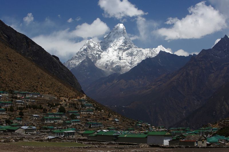 FILE PHOTO: Mount Ama Dablam, which stands approximately 6,800 meters above sea level, is seen behind Khumjung Village in Solukhumbu District April 30, 2014.