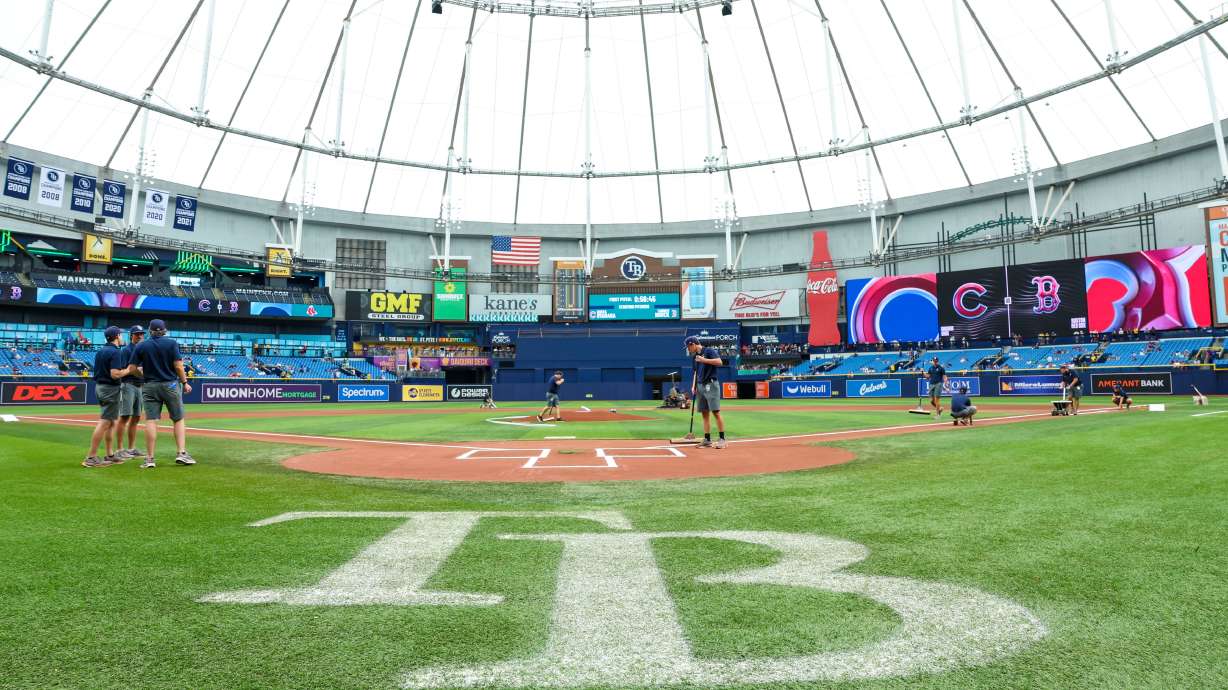 Crews prepare the field for a baseball game between the Chicago Cubs and the Boston Red Sox at Tropicana Field, Sunday, Sept. 27, 2026, in St. Petersburg, Fla.