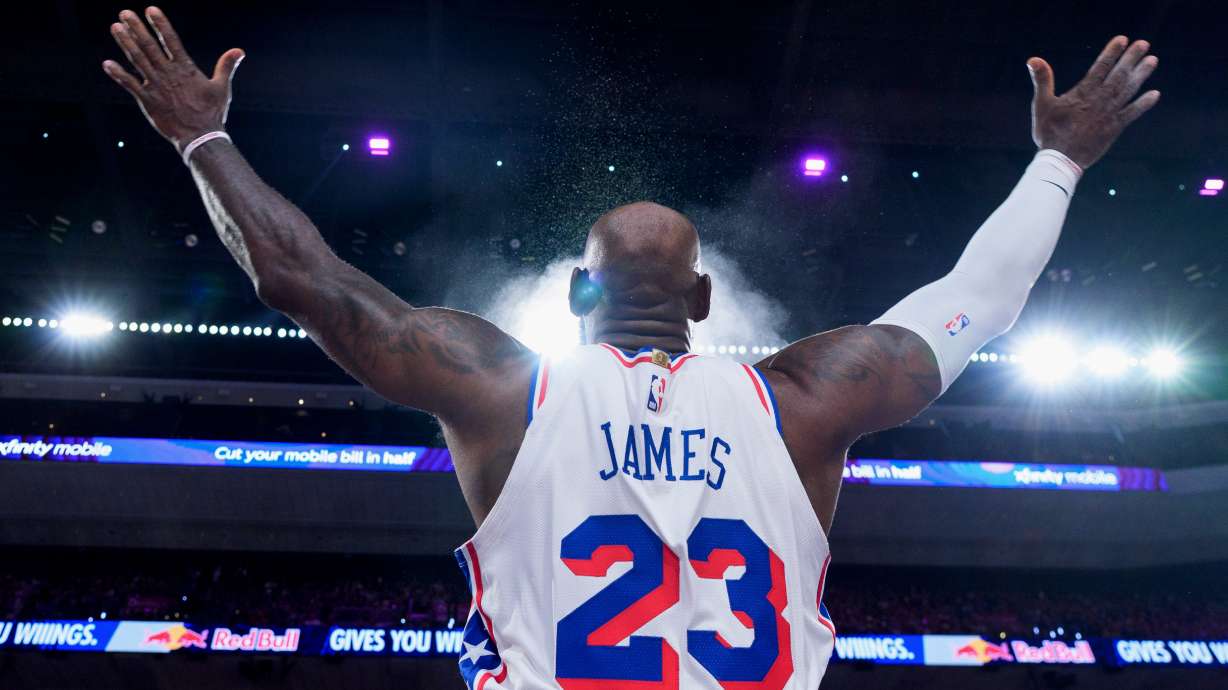 Philadelphia 76ers' LeBron James tosses the chalk in the air ahead of the first half of an NBA basketball game against the Detroit Pistons, Sunday, Oct. 25, 2026, in Philadelphia.