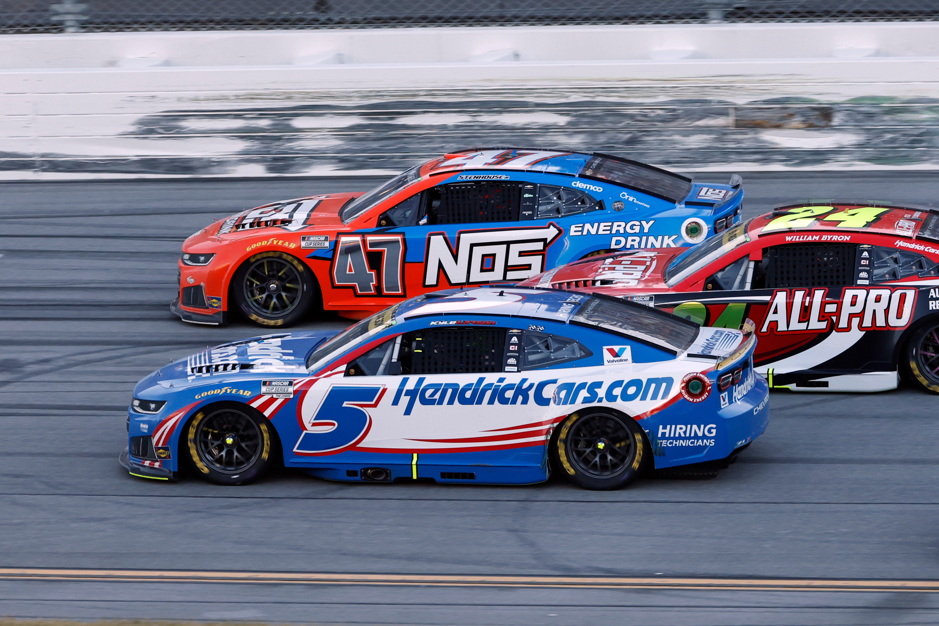 Kyle Larson (5) passes Ricky Stenhouse Jr. (47) for the win in a NASCAR Cup Series auto race, Sunday, Oct. 25, 2026, in Talladega, Ala. 