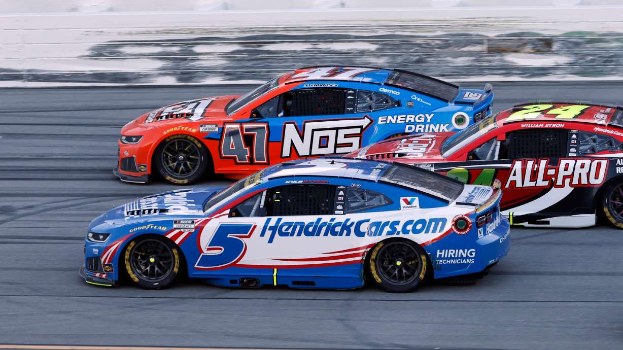 Kyle Larson (5) passes Ricky Stenhouse Jr. (47) for the win in a NASCAR Cup Series auto race, Sunday, Oct. 25, 2026, in Talladega, Ala.