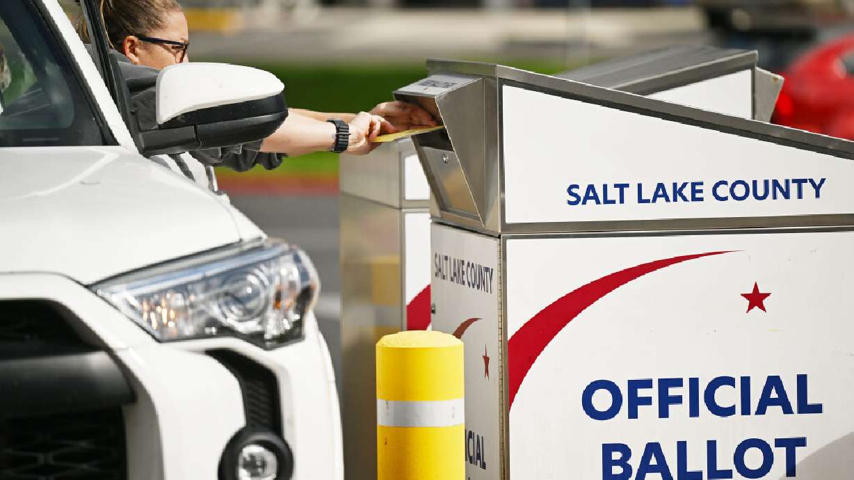 A woman casts her ballot at a drop box at the Salt Lake County Government Center on Monday, Oct. 28, 2024. Early voting is underway, and the Salt Lake County clerk is reminding voters to be aware of important deadlines and changes to mail-in ballot rules ahead of Election Day.